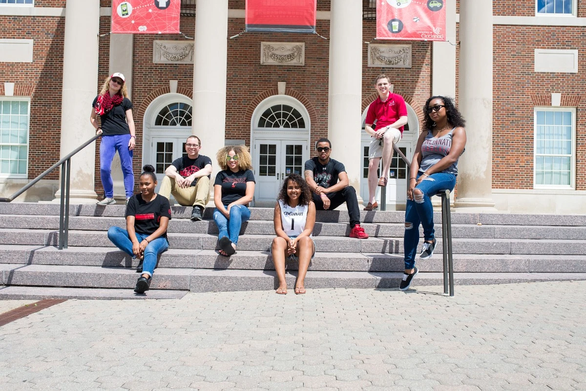 Student leaders sit on outdoor steps