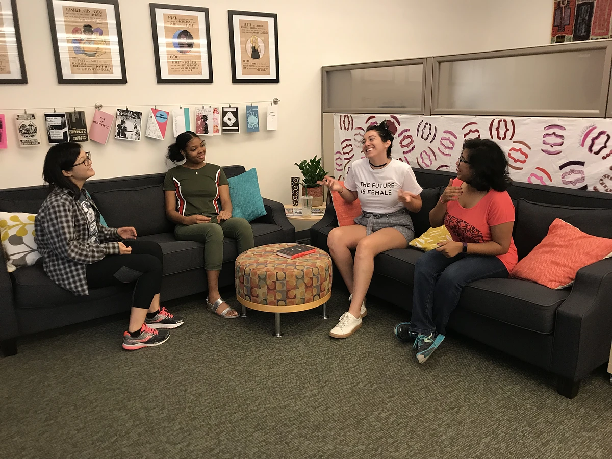 Students sit on couches in the Women's Center